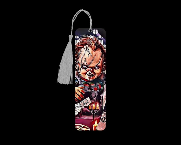 Chucky metal bookmark. The bookmark is metal with a silver tassel. The image is printed onto the top and is smooth and glossy.