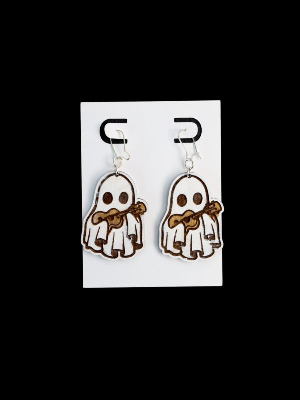 White ghost earrings holding a guitar.