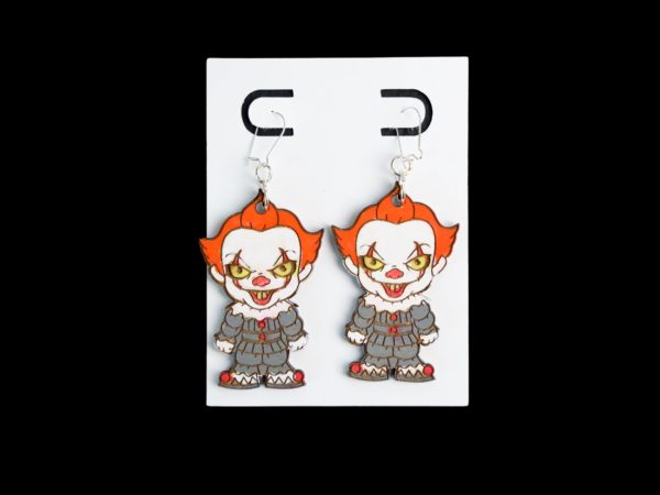 Pennywise wood earrings with a gray suit and orange hair earrings.