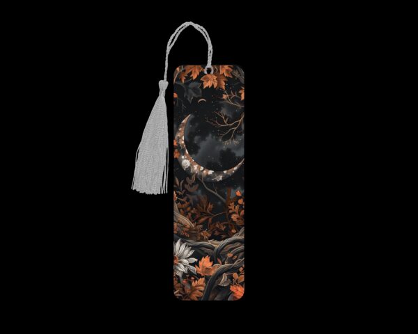 Rustic autumn moon metal bookmark. The bookmark is metal with a silver tassel. The image is printed onto the top and is smooth and glossy.