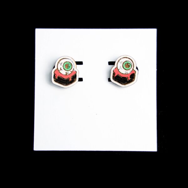 Eyeball Brownie Stud Wood Earrings. These earrings are made with 1/8″ thickness basswood. These earrings are lightweight and hand painted.