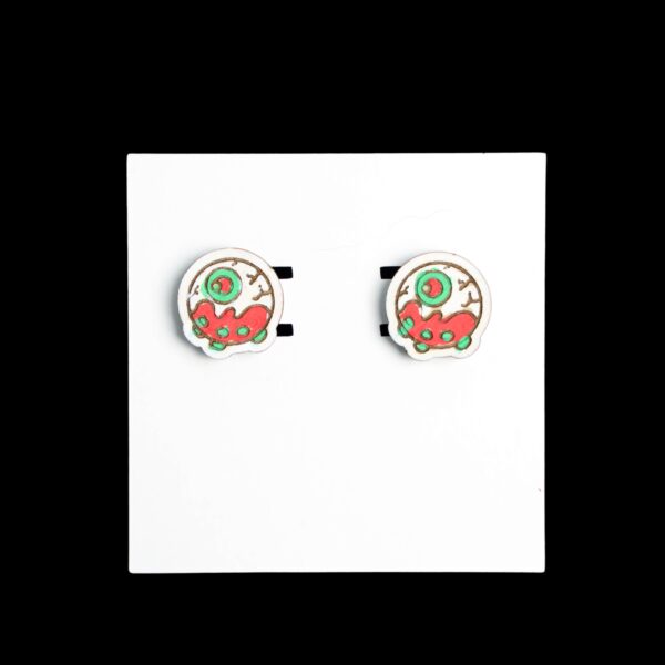 Eyeball Cake Stud Wood Earrings. These earrings are made with 1/8″ thickness basswood. These earrings are lightweight and hand painted.