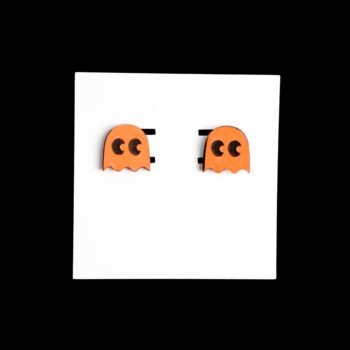 Pacman Ghost Orange Stud Wood Earrings. These earrings are made with 1/8″ thickness basswood. These earrings are lightweight and hand painted.