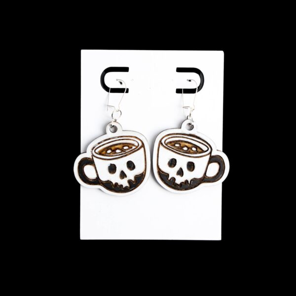 Skull Latte Wood Earrings. These earrings are made with 1/8″ thickness basswood. These earrings are lightweight and hand painted.