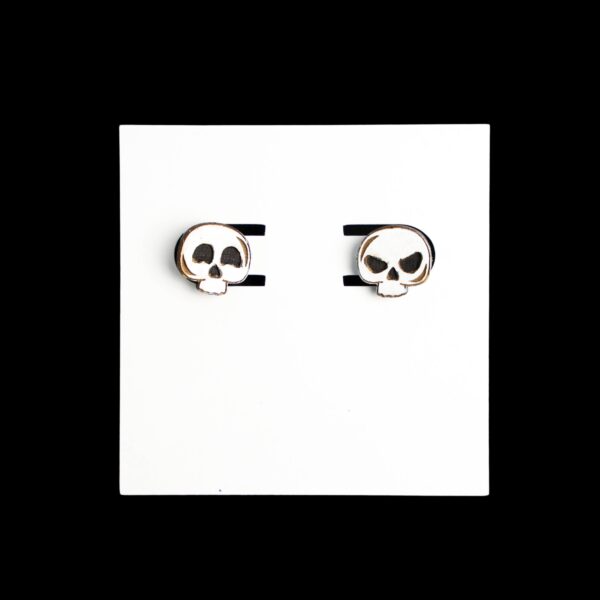 Skull Stud Wood Earrings. These earrings are made with 1/8″ thickness basswood. These earrings are lightweight and hand painted.